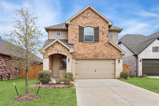 view of front of home with a front yard and a garage