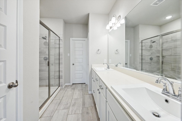 bathroom featuring vanity and walk in shower