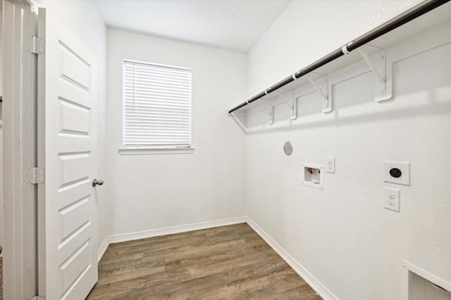 laundry area with hookup for an electric dryer, hookup for a washing machine, hardwood / wood-style flooring, and gas dryer hookup