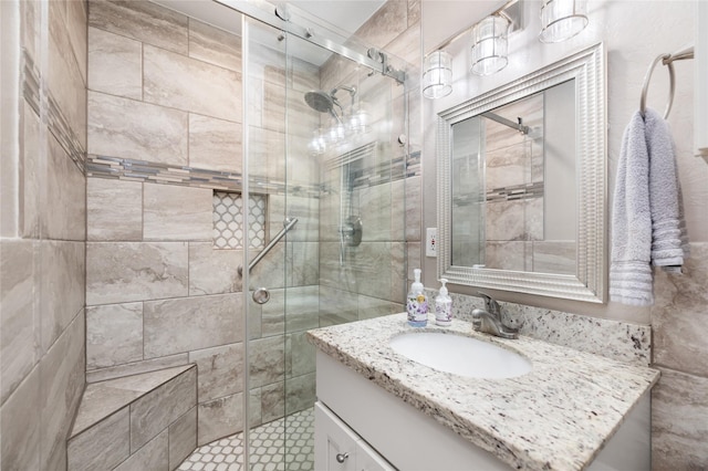 bathroom featuring vanity and an enclosed shower