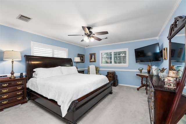 carpeted bedroom featuring ceiling fan and ornamental molding