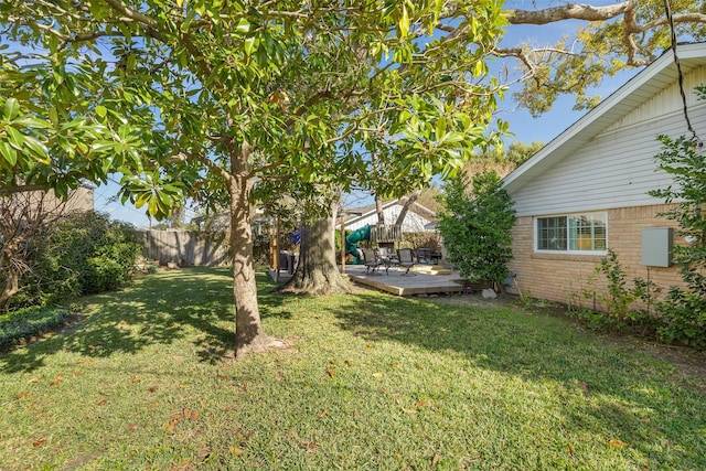 view of yard with a wooden deck