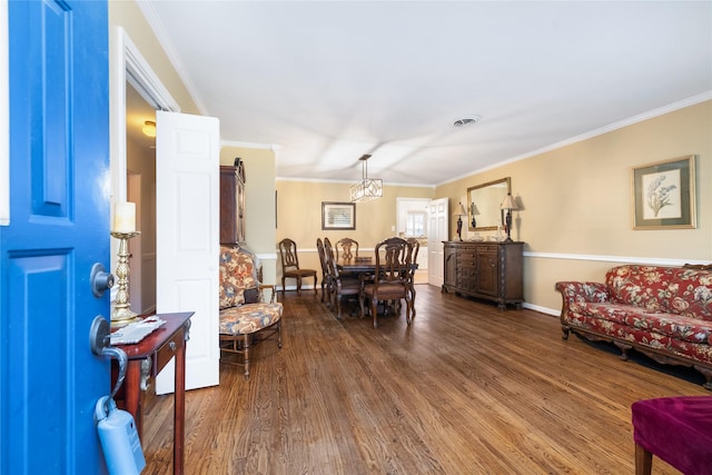 living room with dark hardwood / wood-style floors and ornamental molding