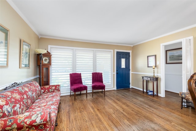 living room featuring crown molding and hardwood / wood-style flooring