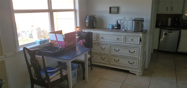 dining area featuring light tile patterned floors and a healthy amount of sunlight