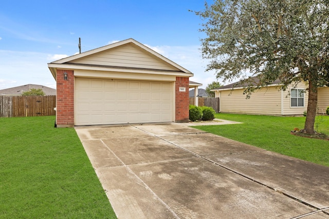 garage featuring a lawn