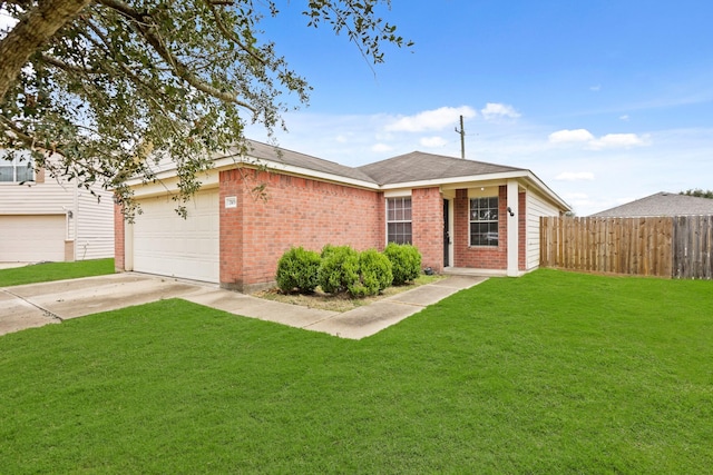 ranch-style house featuring a front yard and a garage