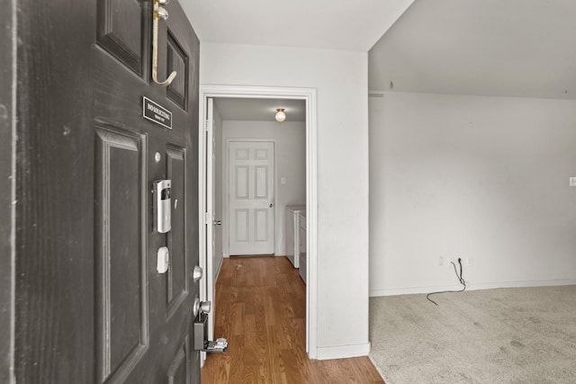 hallway featuring wood-type flooring