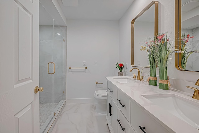 bathroom with vanity, an enclosed shower, and toilet