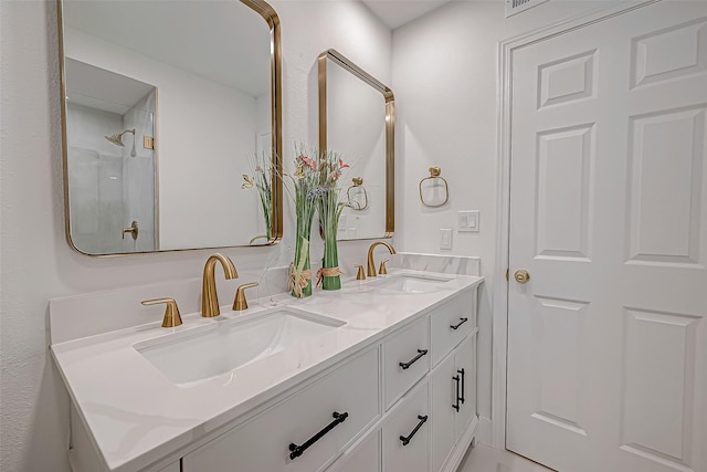 bathroom featuring a shower and vanity