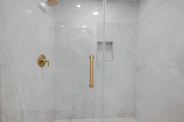 bathroom with tiled shower