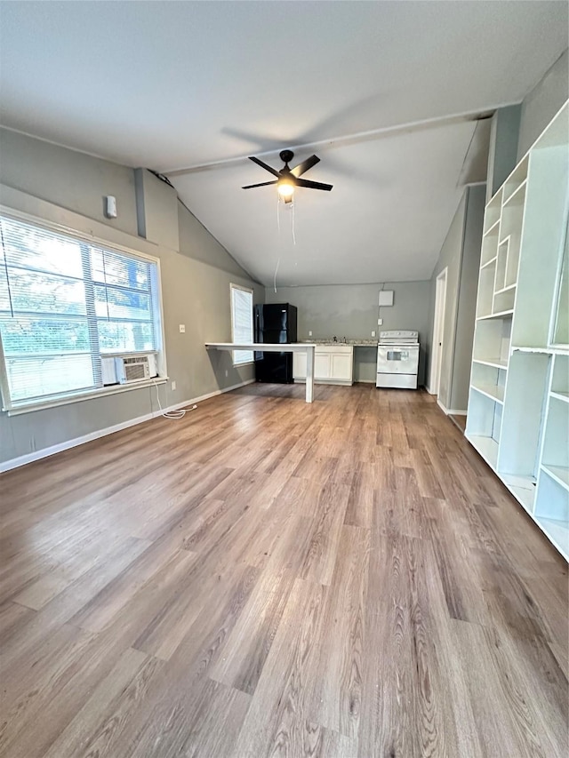 unfurnished living room with light hardwood / wood-style flooring, ceiling fan, and lofted ceiling