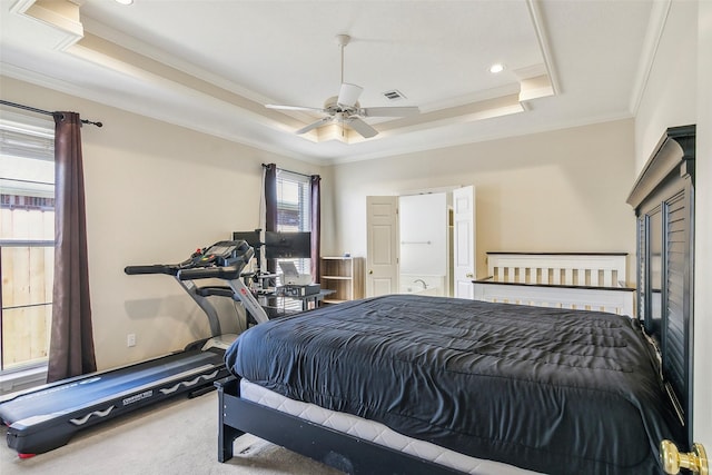 bedroom featuring a raised ceiling, ceiling fan, carpet flooring, and ornamental molding