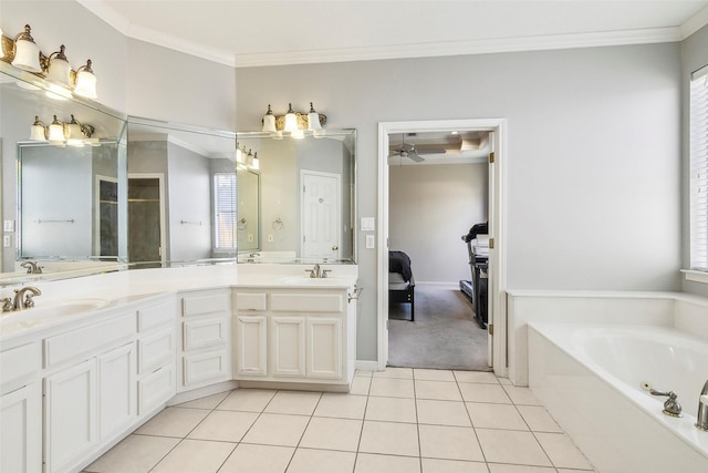 bathroom with tile patterned floors, vanity, a bathtub, and ornamental molding