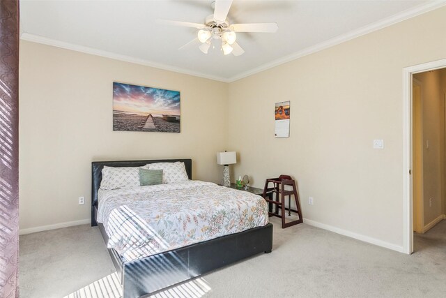 bedroom with ceiling fan, light colored carpet, and ornamental molding