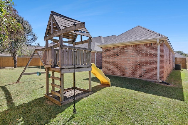 view of playground featuring a yard and central AC