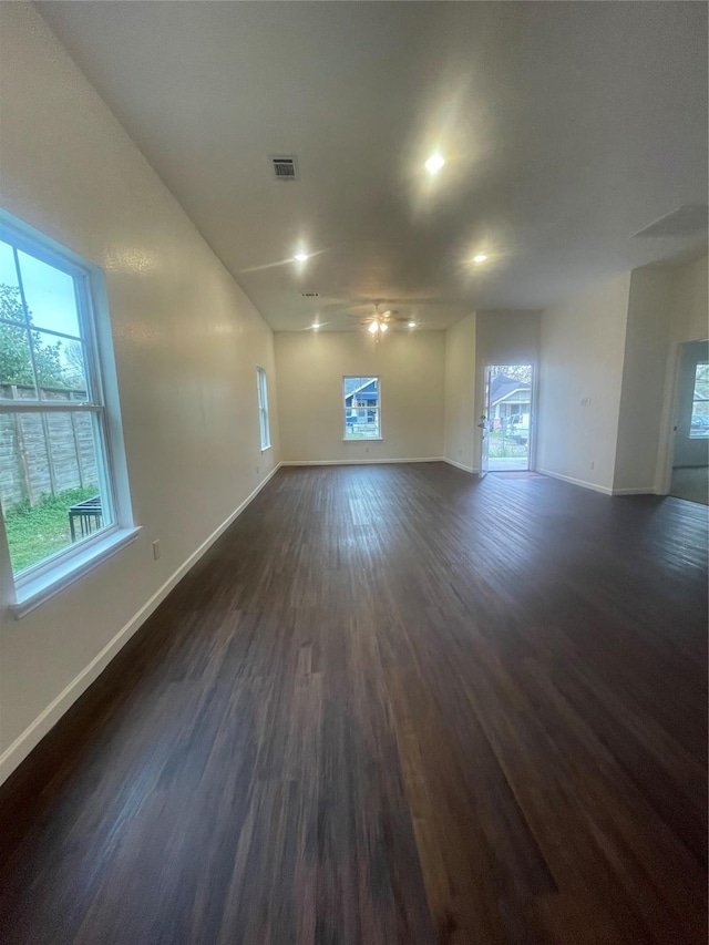 spare room with ceiling fan and dark hardwood / wood-style flooring