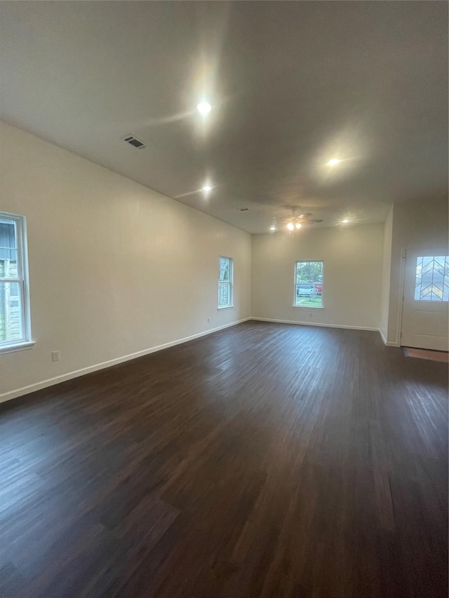 unfurnished room featuring dark hardwood / wood-style flooring