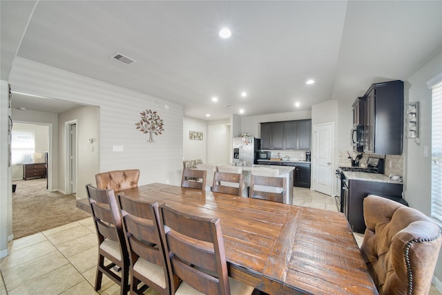 view of carpeted dining area