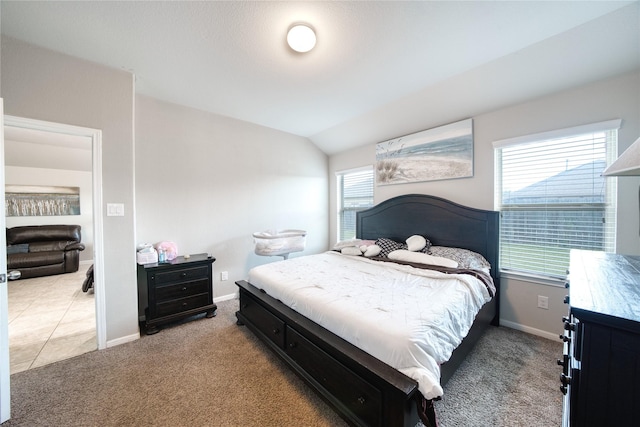 carpeted bedroom featuring vaulted ceiling