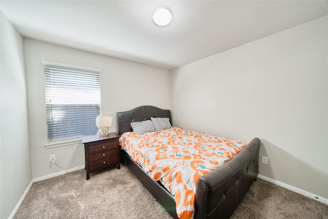 bedroom with light colored carpet