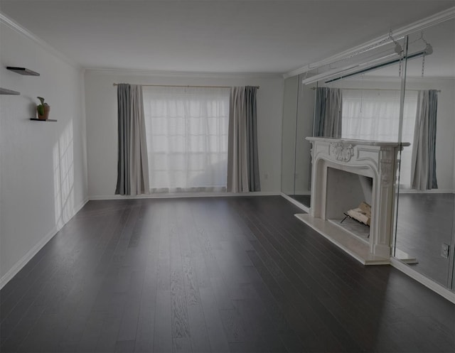 unfurnished living room with dark wood-type flooring and crown molding