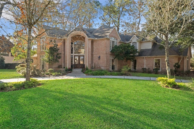 view of front of home with french doors and a front yard