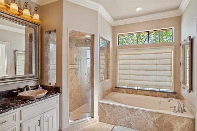 bathroom with plus walk in shower, vanity, and ornamental molding