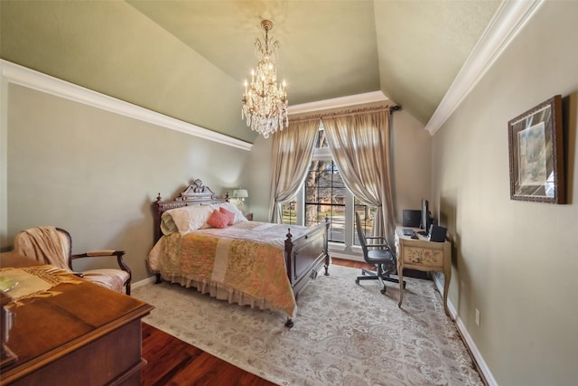 bedroom featuring vaulted ceiling, hardwood / wood-style flooring, an inviting chandelier, and ornamental molding