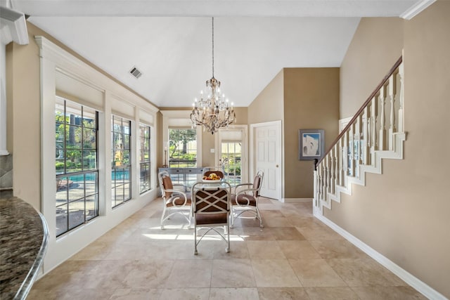 dining area with a wealth of natural light and an inviting chandelier