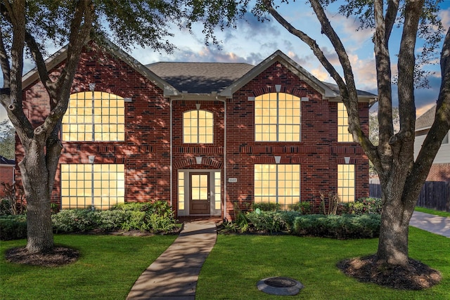 view of property featuring a lawn