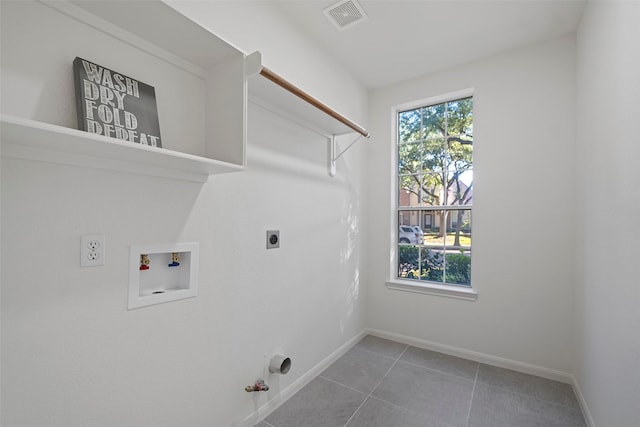 laundry area with hookup for an electric dryer, gas dryer hookup, and hookup for a washing machine