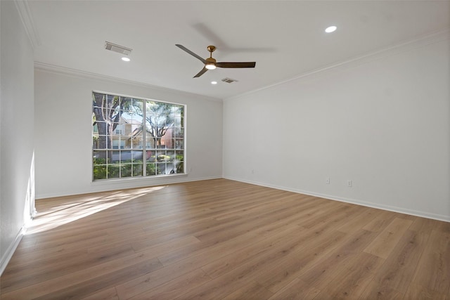 unfurnished room with light hardwood / wood-style floors, ceiling fan, and crown molding