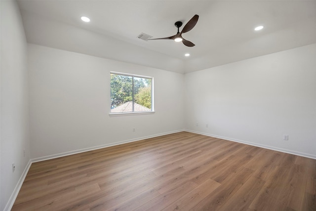 empty room featuring ceiling fan and light hardwood / wood-style floors