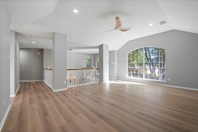 interior space with light hardwood / wood-style flooring, vaulted ceiling, and ceiling fan