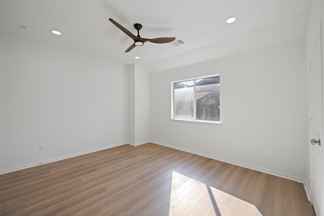 spare room featuring light hardwood / wood-style floors and ceiling fan