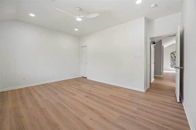 unfurnished room featuring ceiling fan, lofted ceiling, and light wood-type flooring