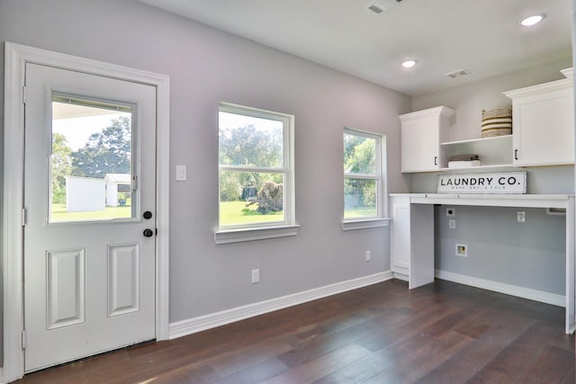 kitchen featuring white cabinets and dark hardwood / wood-style floors