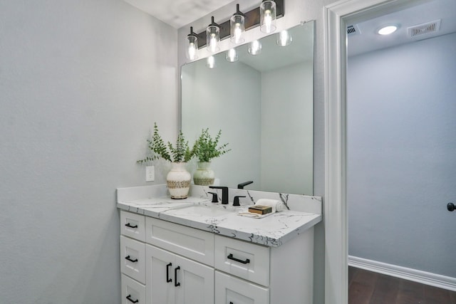 bathroom featuring vanity and wood-type flooring