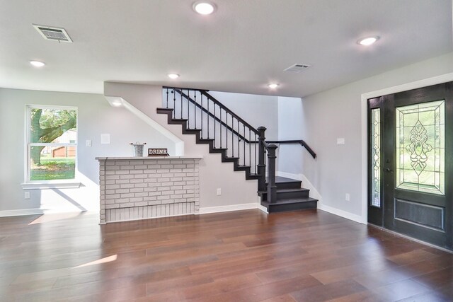 entrance foyer with dark hardwood / wood-style flooring