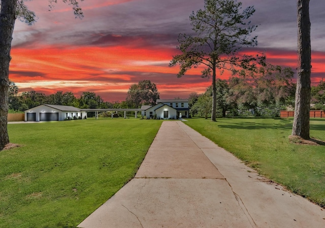 view of property's community with a yard