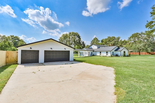 single story home featuring a garage and a front yard