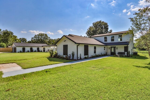 view of front of house with a front lawn