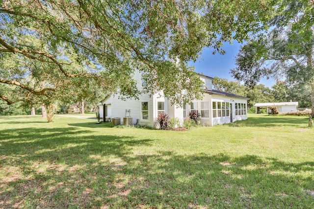 view of yard featuring a sunroom