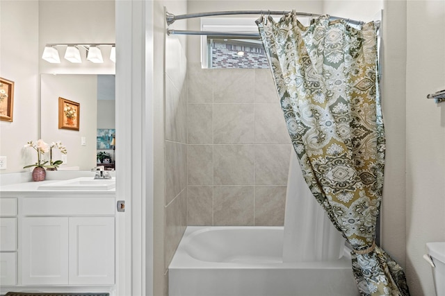 full bathroom featuring vanity, toilet, and shower / tub combo with curtain