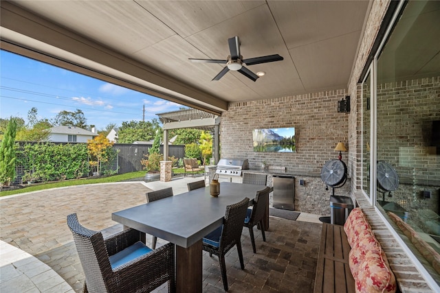 view of patio featuring ceiling fan and a grill