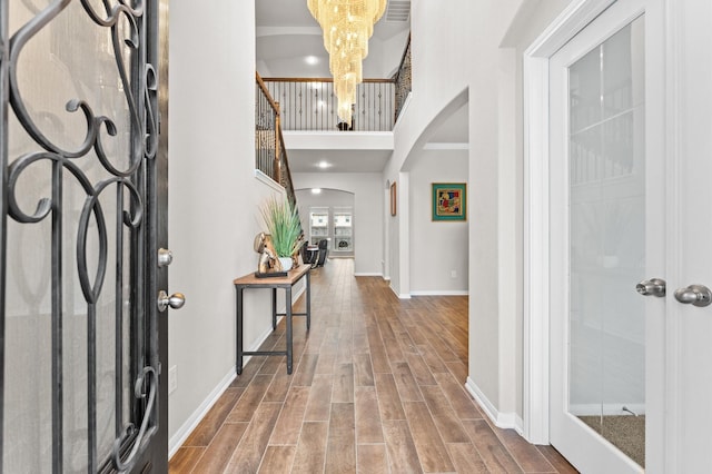 foyer with a chandelier and a high ceiling