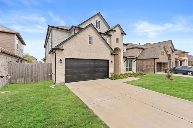 view of front of house featuring a garage and a front yard