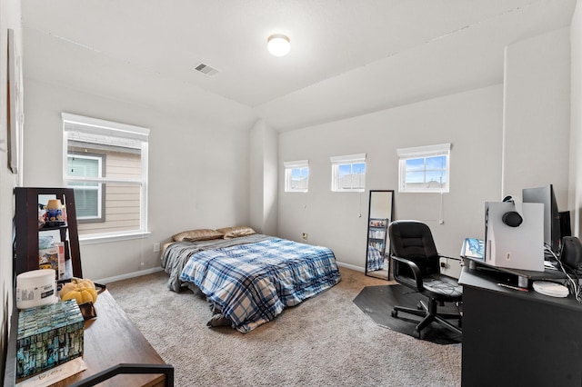 bedroom featuring light colored carpet