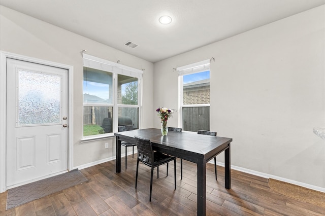 dining area featuring dark hardwood / wood-style flooring